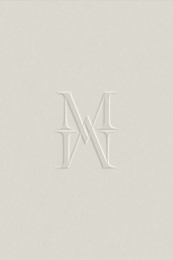 the letter m is made out of white paper