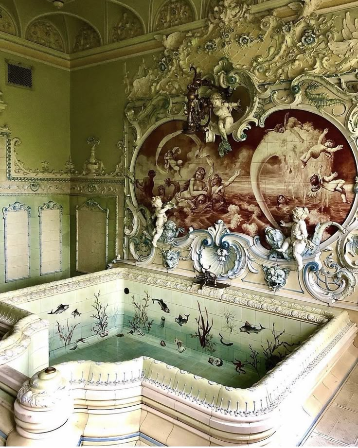 an ornately decorated bathtub in the middle of a room