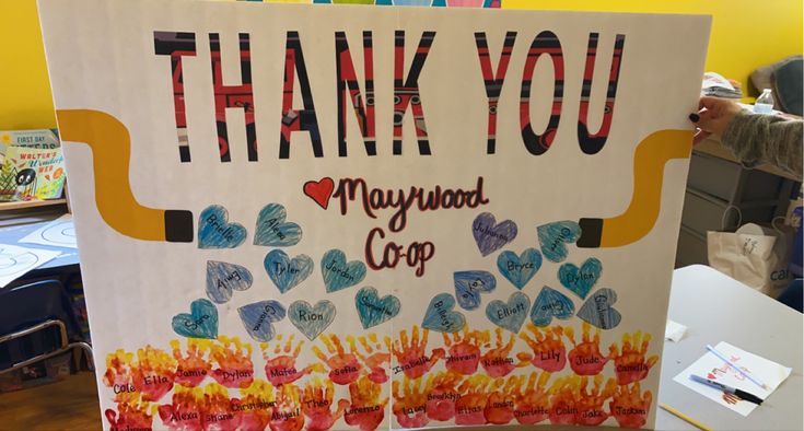 a sign that says, thank you maynou cup with hearts and fire on it