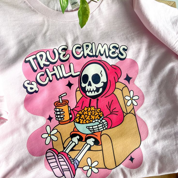 👻🎃👻 Ghouls (girls) just wanna have fun and wear cute spooky season tees🥰 #truecrimejunkie #truecrimefan #spookyseason #halloweenvibes #spookygirl #spookygirlsdoitbetter #spookyvibes #stayspooky #halloween365 #halloweenallyear #truecrimeandchill #truecrimeaddict #truecrimeobsessed #cozy #cozyvibes #thisishalloween #smallbusiness #smallbiz Novelty Long Sleeve T-shirt With Graphic Print, Trendy Cotton Skull Print Tops, Pop Culture Crew Neck Top With Funny Print, Pop Culture Screen Print Tops For Fall, Trendy Pink Skull Print Top, Trendy Pink Tops With Skull Print, Trendy Pink Top With Skull Print, Pop Culture Tops With Funny Print And Relaxed Fit, Pop Culture Tops With Funny Print In Relaxed Fit