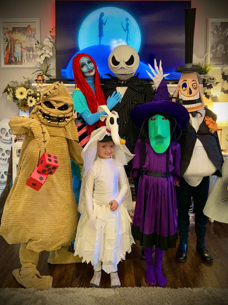 a group of people in costumes standing next to each other