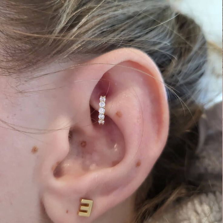 Description: The gold helix hoop earring is paved with Shiny CZ, cute and dainty. This is a really wonderful piece that is perfect for daily wear or special occasions! Helix Hoop Earring, Helix Hoop, Earring Hoop, Crystal Gems, Helix, Real Gold, Diamond Earrings, Daily Wear, 14k Gold