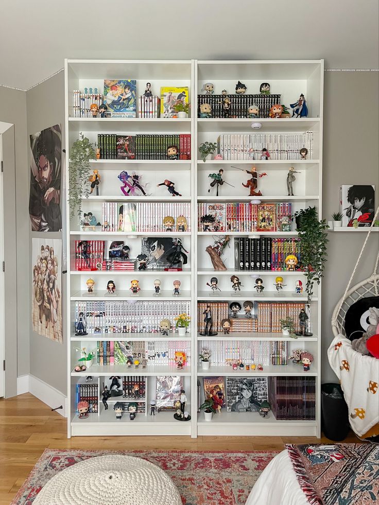 a book shelf filled with lots of books on top of a hard wood floor next to a rug