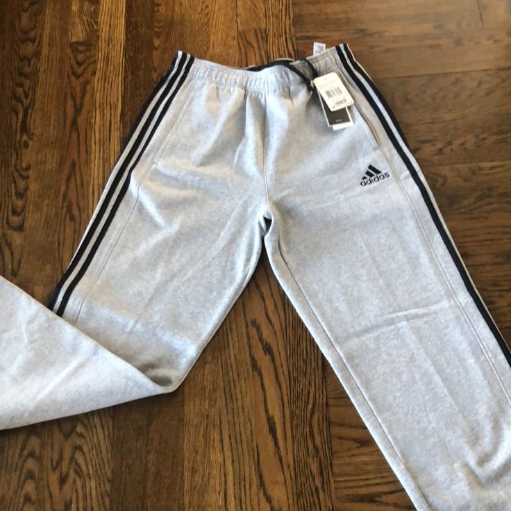 Brand New Adidas Light Gray Sweatpants Adidas Sporty Loungewear Pants, Adidas Jogging Pants With Pockets, Cotton Sports Bottoms With Three Stripes Branding, Adidas Jogging Bottoms With Pockets, Adidas Cotton Athleisure Bottoms, Sporty Adidas Cotton Pants, Cotton Sportswear Bottoms With Three Stripes Branding, Cotton Sportswear Bottoms With Three Stripes, Adidas Gray Sports Bottoms