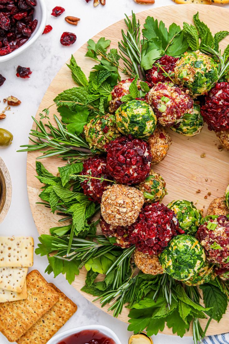 a platter filled with broccoli, cranberry sauce and crackers