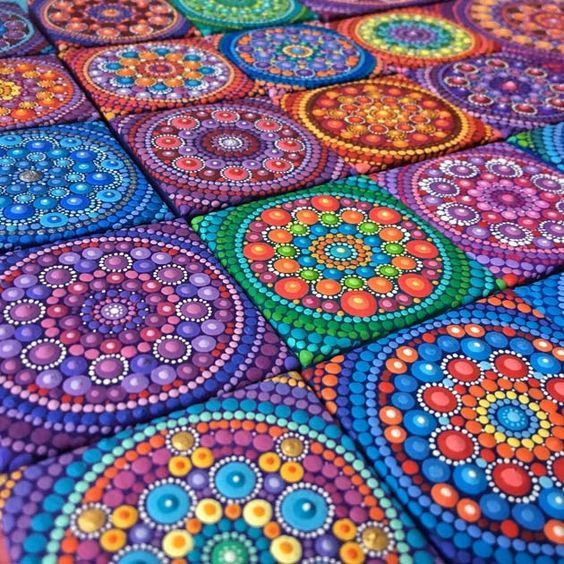 a colorful table cloth with circles and dots on the surface, painted in bright colors