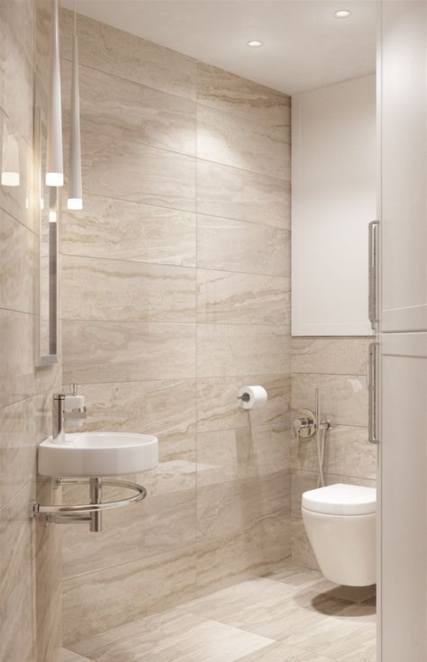 a white toilet sitting next to a sink in a bathroom