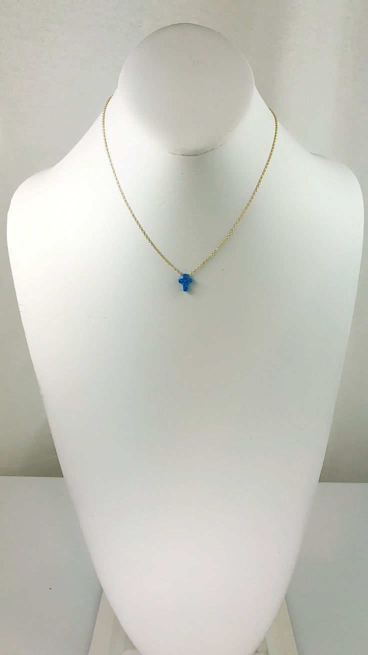 Description Simple. Chic. Minimalist™ A perfectly dainty brilliant synthetic fiery blue opal cross is floating freely on a delicate feminine 14k gold plated over Sterling silver chain. This cute and tiny star charm necklace features a synthetic created blue opal moon stone with sterling silver chain. This lovely star necklace is perfect for complementing a casual outfit, and you can even layerbit with other necklace to create something unique. * High Quality 925 Sterling Silver link chain with s Cheap Blue Charm Necklace With Round Pendant, Blue Opal Cross Necklace, Star Charm Necklace, Silver Link Chain, Delicate Feminine, Tiny Star, Simple Chic, Cross Charms, Opal Necklace