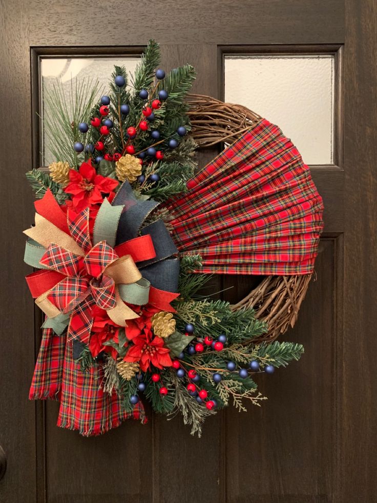 a christmas wreath hanging on the front door