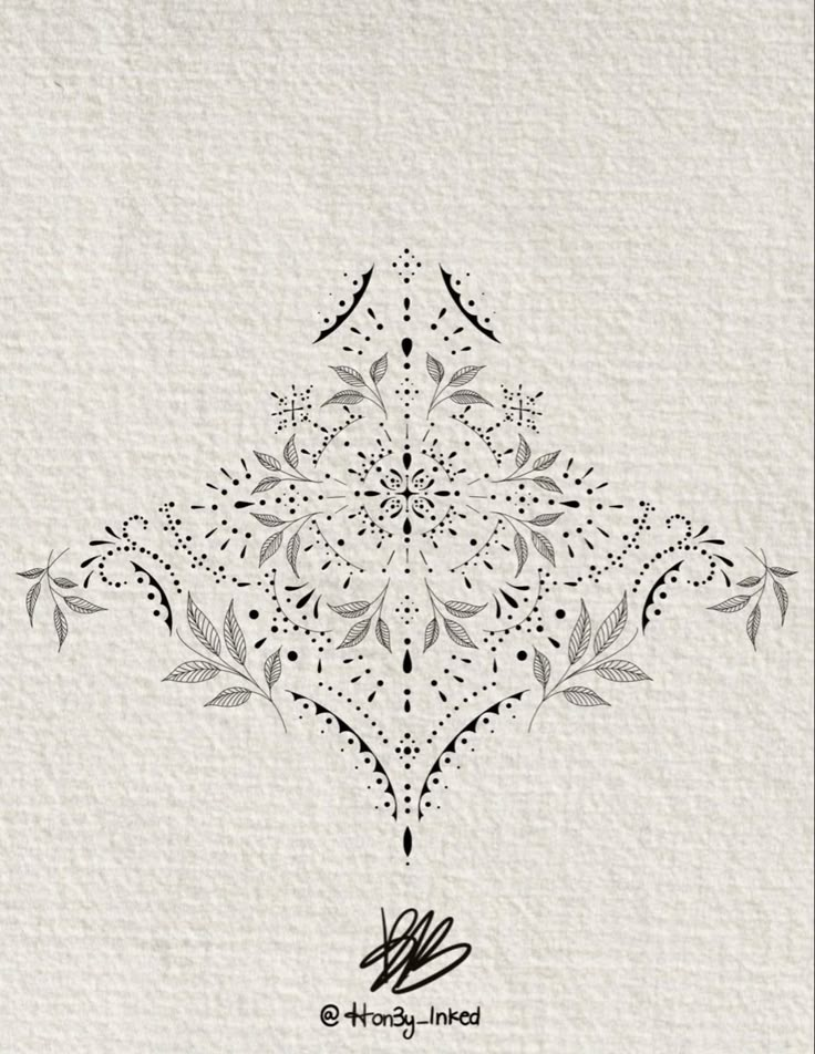 a white and black ornamental design on a piece of paper