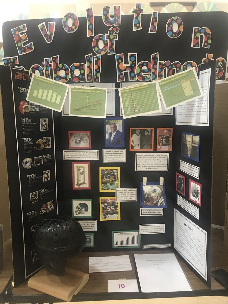 a bulletin board with pictures and papers on it