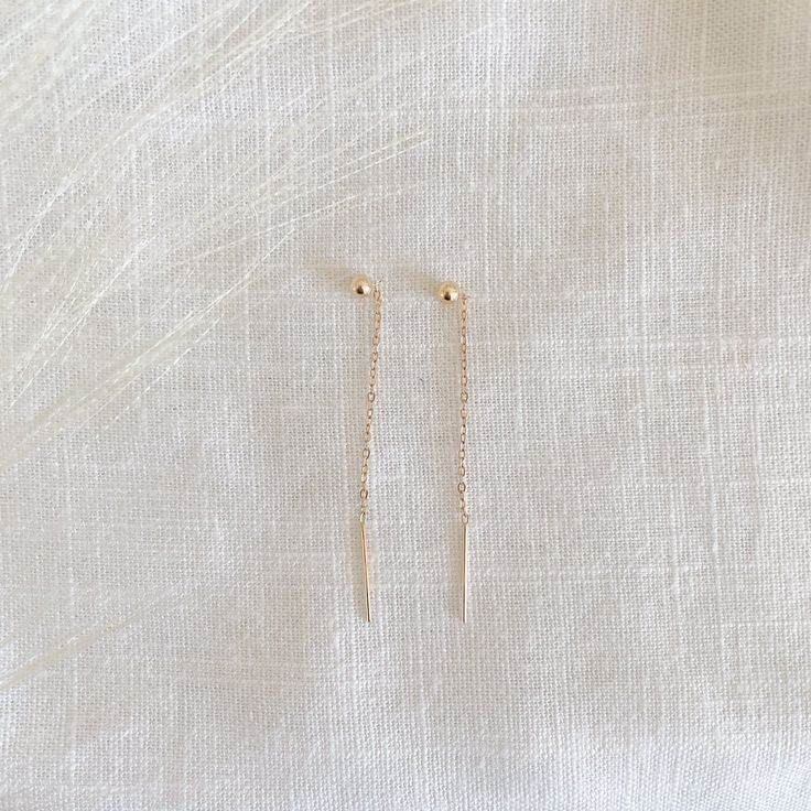 14k gold filled ball ear threaders Length: 1.2" total threader length Sold as a pair Please note: all earrings are final sale Ear Threader, Ball Drop, Final Sale, Arrow Necklace, Gold Filled, Gold