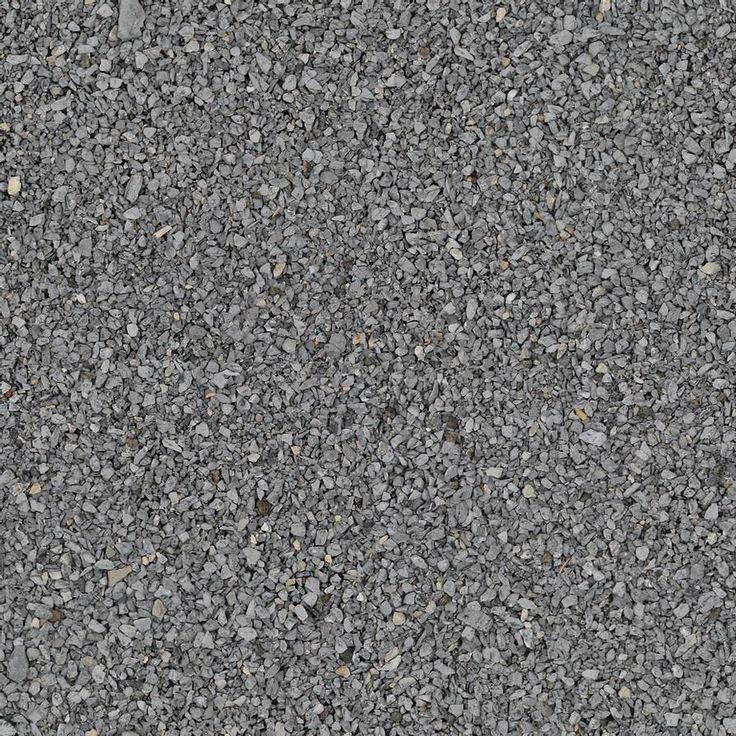 an asphalt surface with small rocks and gravel