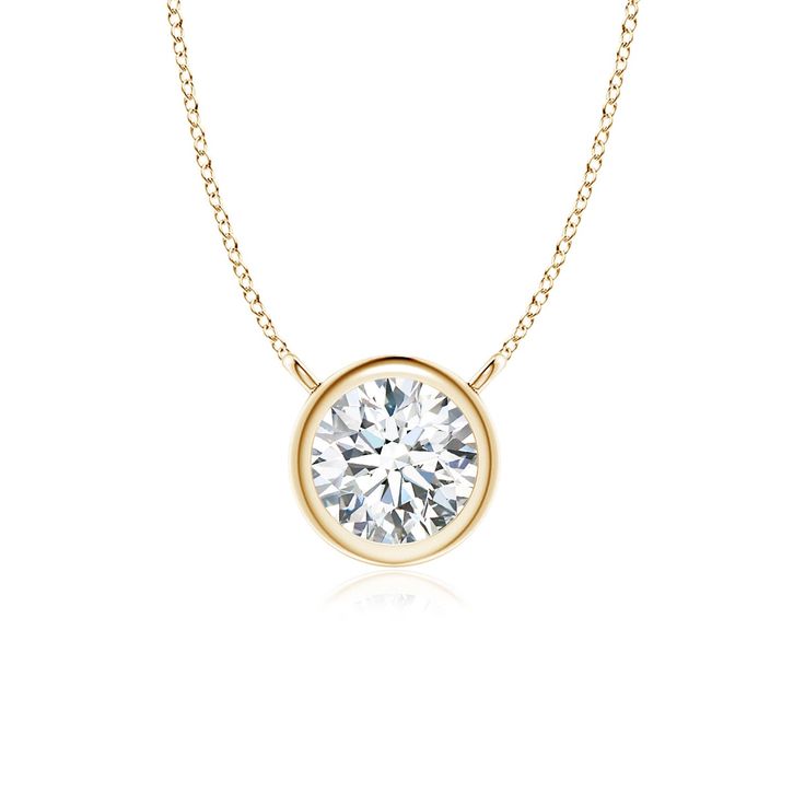 This bezel-set pendant necklace, crafted in 14k yellow gold, is a perfect mix of extravagance and simplicity. The solitaire diamond pendant is attached to the chain by the loops. Cut in a classic round shape, the diamond shines with unmatched brilliance. Choose from different stone qualities (K, I3, I-J, I1-I2, H, SI2, GH VS) and multiple total carat weight options. Solitaire Diamond Pendant, Solitaire Necklace, Solitaire Pendant Necklace, Diamond Solitaire Necklace, Solitaire Necklaces, Solitaire Diamond, Solitaire Pendant, Diamond Pendant Necklace, Fine Jewellery Necklace