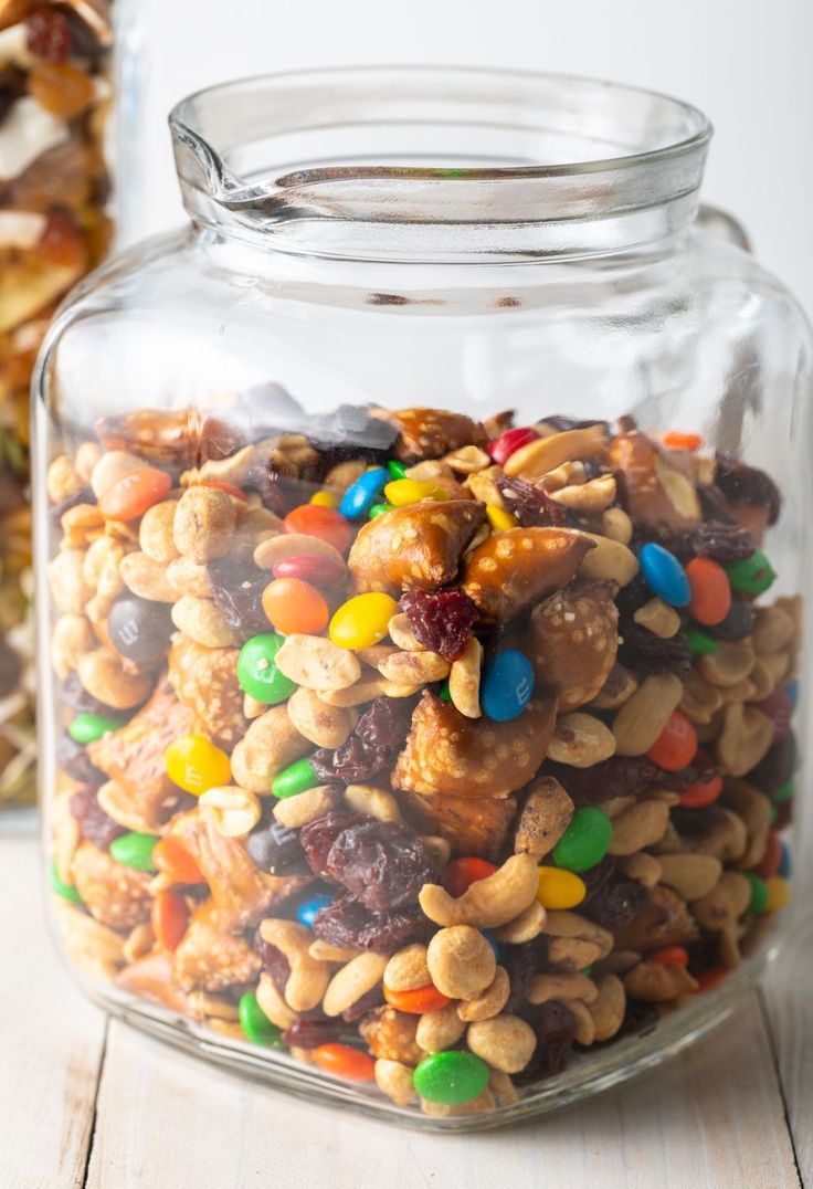 a glass jar filled with nuts and candy