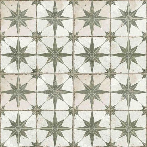 a white and green tile pattern with stars on it