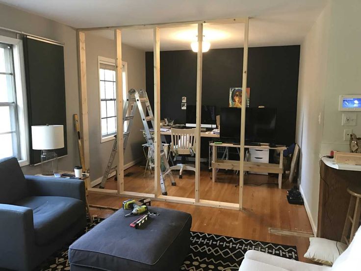 a living room filled with furniture next to a window