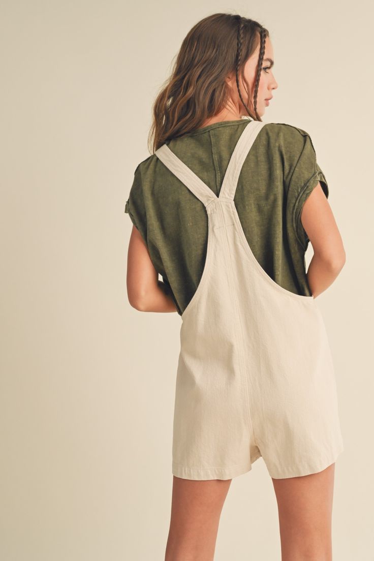 This "Harbor" romper flaunts effortless, relaxed style. Its tied sleeves and large pockets offer comfort and convenience. Crafted from lightweight, breathable fabric, it's sure to be your go-to piece for easygoing days. Summer Shortalls With Pockets In Relaxed Fit, Relaxed Fit Cotton Shortalls For Day Out, Summer Relaxed Fit Shortalls With Pockets, Relaxed Fit Summer Shortalls With Pockets, Summer Style Relaxed Fit Shortalls With Pockets, Relaxed Fit Cotton Overalls For Day Out, Casual Relaxed Fit Shortalls For Day Out, Relaxed Fit Everyday Jumpsuits And Rompers, Relaxed Fit Everyday Overalls And Rompers