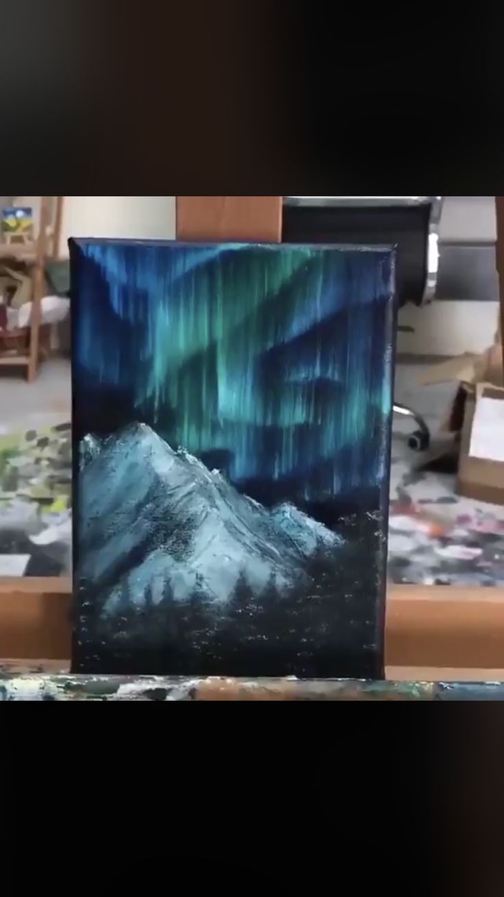 an image of the aurora bore in the night sky with mountains and trees painted on it