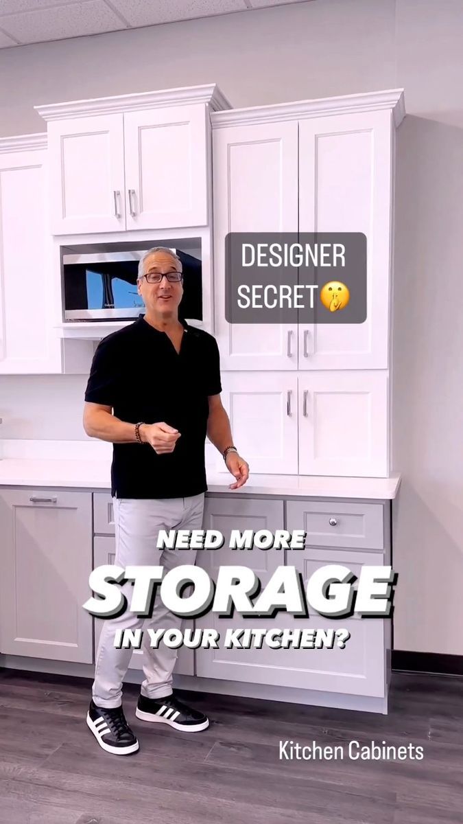 a man standing in front of a kitchen with the words need more storage in your kitchen