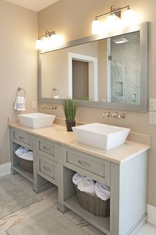 a bathroom vanity with two sinks and mirrors