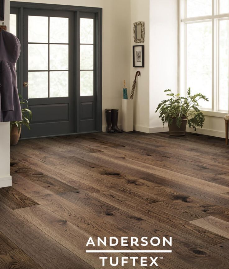 the interior of a house with wood flooring