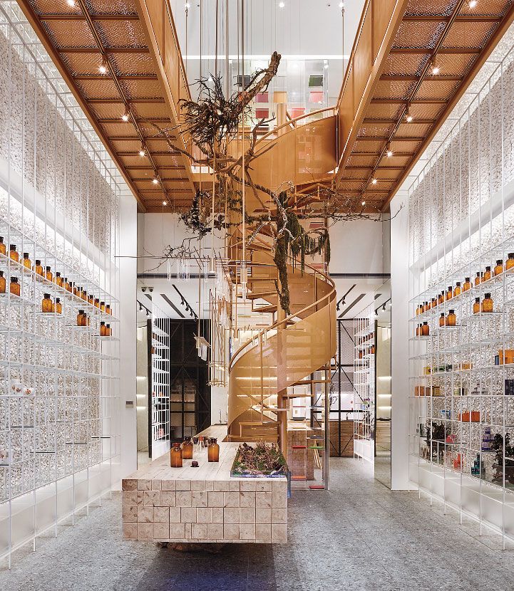 a large staircase in the middle of a room with glass tiles on the walls and floor