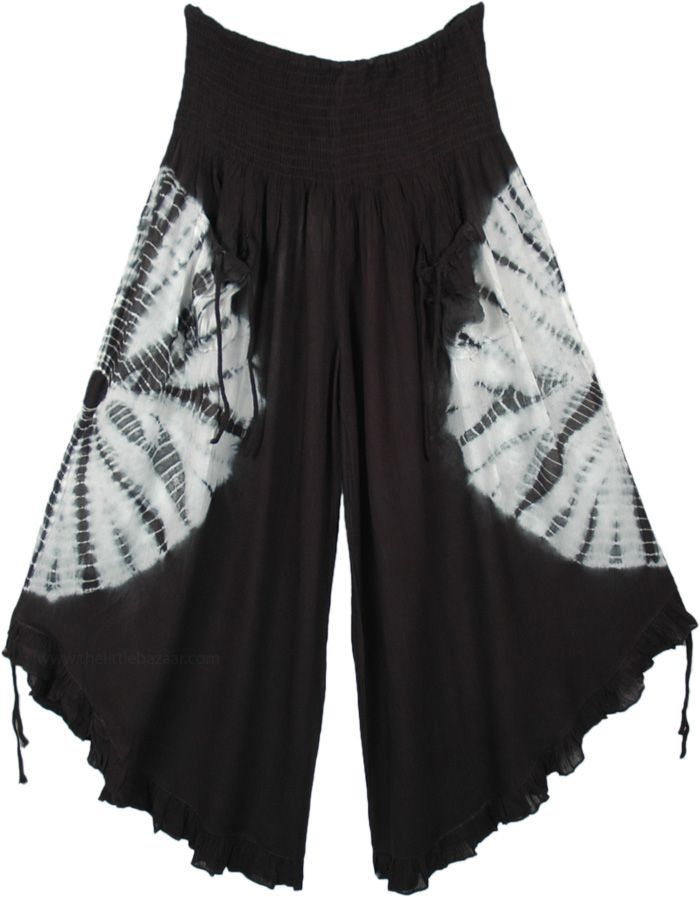 A cropped wide-leg pant. features smocked elastic waistband, 2 front tie pockets, and tie ruffle leg opening. A chic pair of wide-leg culotte pants in black with a white tie-dye that goes around the middle of the pants, back, and front. This style is totally fresh and you will be ahead of fashion. The front pockets come with a functional tie-up string that gives it a boho look. Similar functional tie-ups are attached at the bottom of these pants and can be pulled to make the leg opening higher. Summer Parachute Pants With Drawstring, Summer Harem Pants With Drawstring, Bohemian Wide-leg Pants With Drawstring, Bohemian Drawstring Trousers, Bohemian Wide-leg Drawstring Pants, Summer Drawstring Wide-leg Harem Pants, Summer Wide-leg Harem Pants With Drawstring, Bohemian Drawstring Harem Pants For Spring, Bohemian Bottoms With Drawstring For Spring