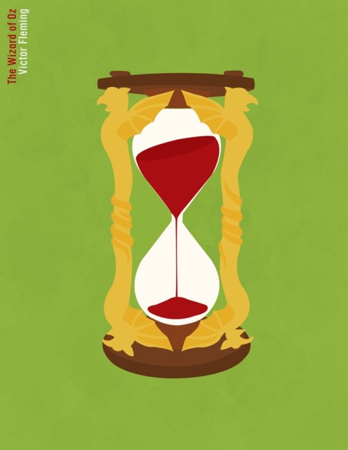 an hourglass with red sand inside on a green background