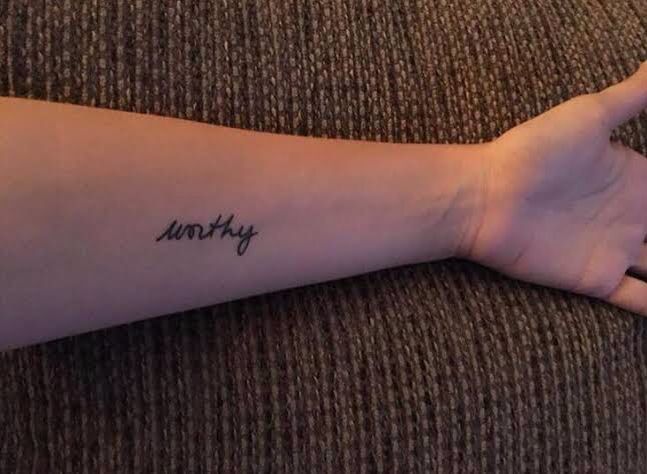 a person's arm with a tattoo that says mommy on the left side of their arm