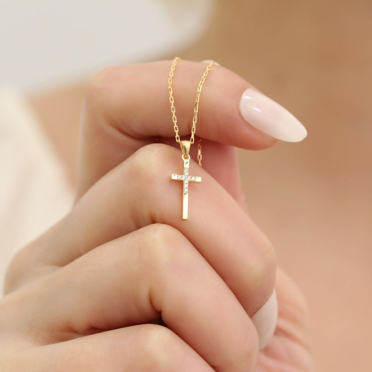 Discover the timeless elegance of our 14K Solid Gold Real Diamond Cross Necklace, a perfect blend of faith and luxury. Handcrafted with meticulous care, this necklace features pristine real diamonds set in a striking cross pendant, making it a stunning statement piece for any occasion. The gleaming 14K solid gold adds a touch of sophistication, ensuring that the necklace is both durable and radiant. The delicate yet sturdy chain measures between 14 and 24 inches, providing a flattering fit for d Elegant Jewelry For First Communion, 14k Gold Cross Necklace As Gift, Classic 14k Gold Cross Necklace For Gift, Wedding Necklace With Diamond Cut Cross Pendant, Classic 14k Gold Cross Necklace As Gift, 14k Yellow Gold Cross Necklace, 14k Gold Cross Pendant Jewelry For Wedding, Dainty Cross Pendant Jewelry For Formal Occasions, Dainty Cross Necklace For Formal Occasions