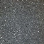 a black and white photo of snow flakes on the ground, taken from above