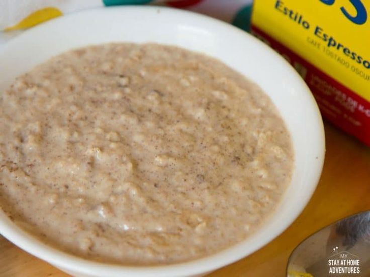 a bowl of oatmeal next to a box of cereal