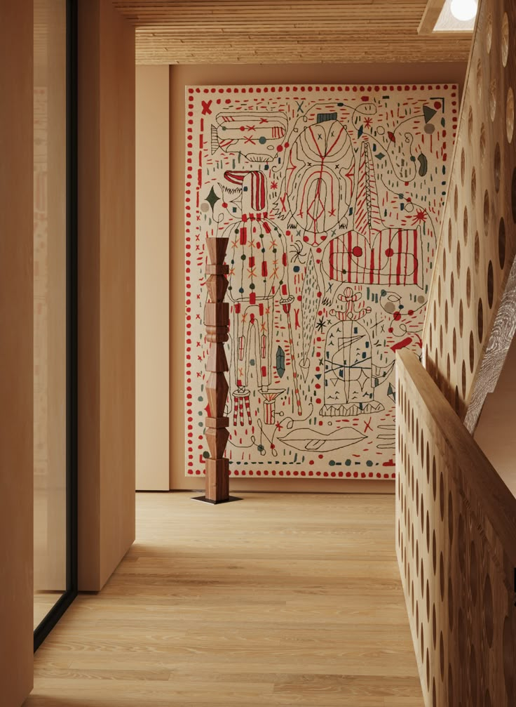 the hallway is decorated with an intricately designed wallpaper and wooden handrails