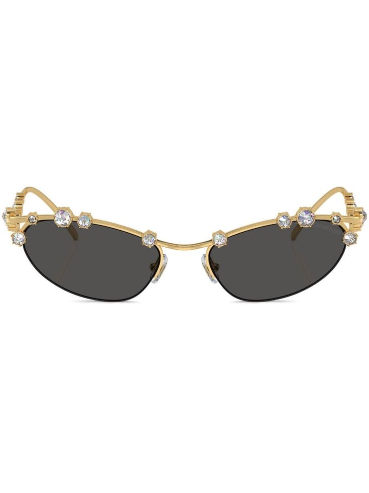 gold-tone metal polished finish Swarovski crystal embellishment tinted lenses cat-eye frame nose pads sculpted arms curved tips These glasses come with a protective case. Sea Witchery, Stylist Closet, Pretty Sunglasses, Sculpted Arms, Tinted Glasses, Designer Shades, Jelly Shoes, Suspender Dress, Eyewear Womens