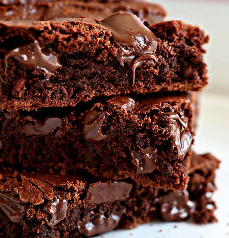 three chocolate brownies stacked on top of each other