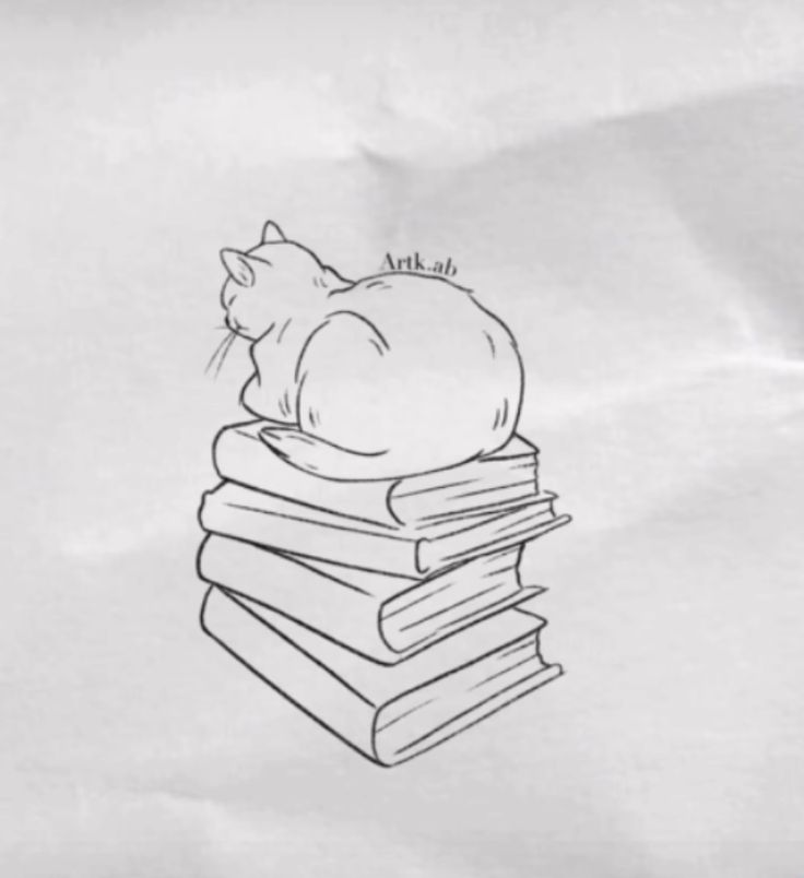 a cat laying on top of a pile of books with the caption artklab