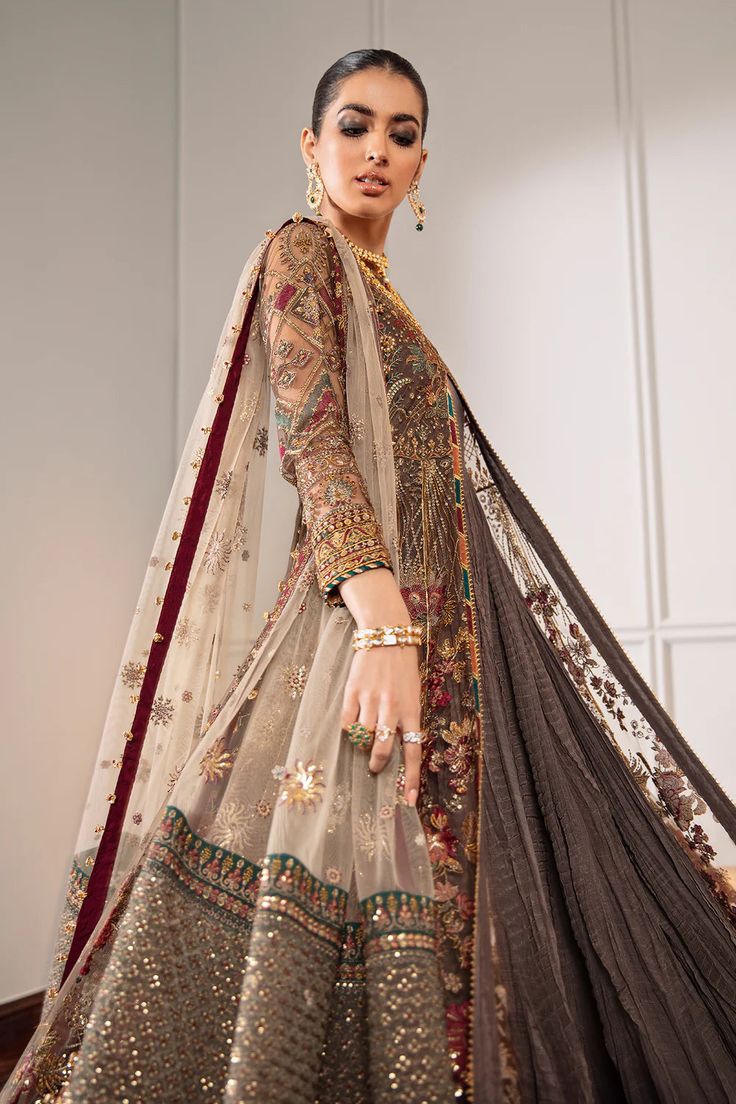 A delicately crafted 4-piece exquisite net ensemble to make you stand out. The ravishing embroidery with intricate floral and floret patterns upholds the luxury this dress offers. Embroidery runs through shirt and dupatta, lightening up the vista. The dyed silk trouser completes the outfit. The inner of the gown is stitched plain (not crushed as shown) The design accessories showcased in images are included. Original Designer Dress Dress fabric: Net Embroidered front and back Embroidered net sle Anarkali With Jacket, Tissue Lehenga, Dress With Vest, Net Sleeves, Organza Lehenga, Salwar Kamiz, Chiffon Collection, Embroidered Chiffon, Ghagra Choli