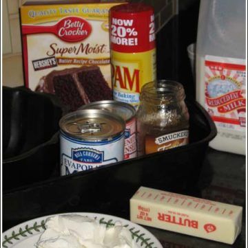 some food is sitting on a table with milk, butter and other things to eat