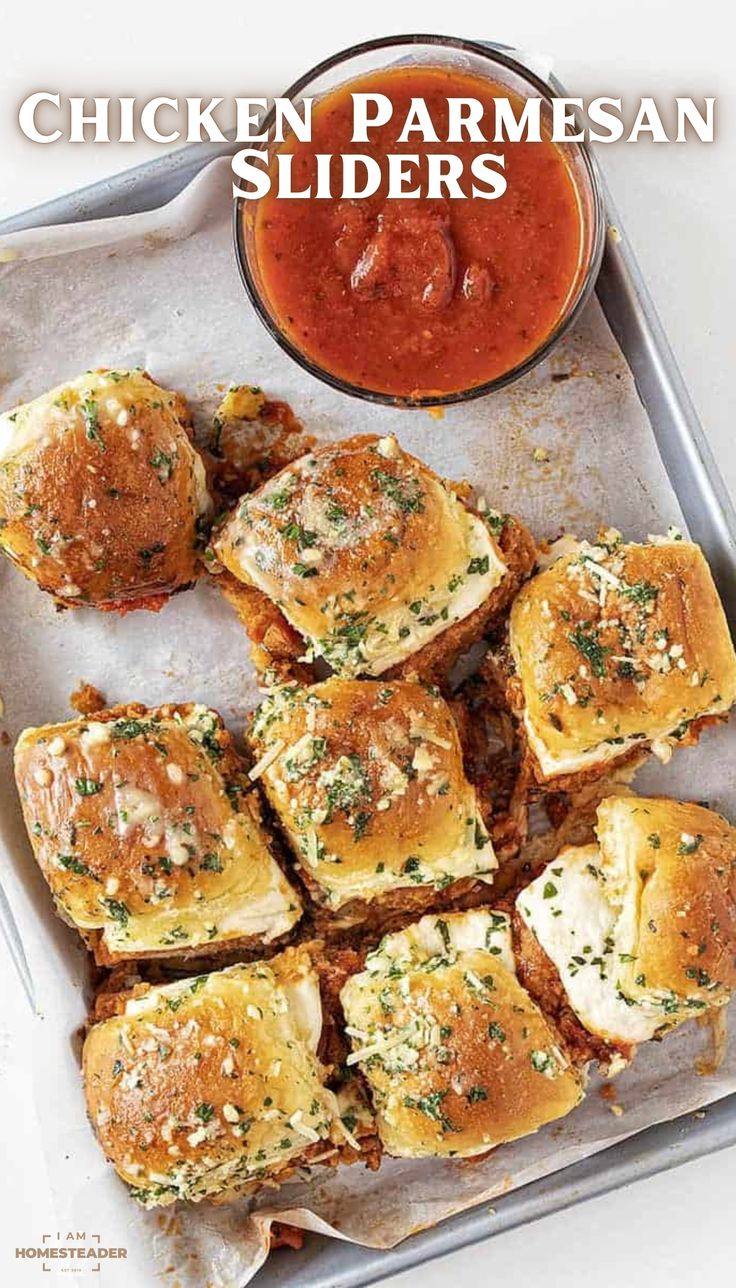 chicken parmesan sliders on a tray with dipping sauce