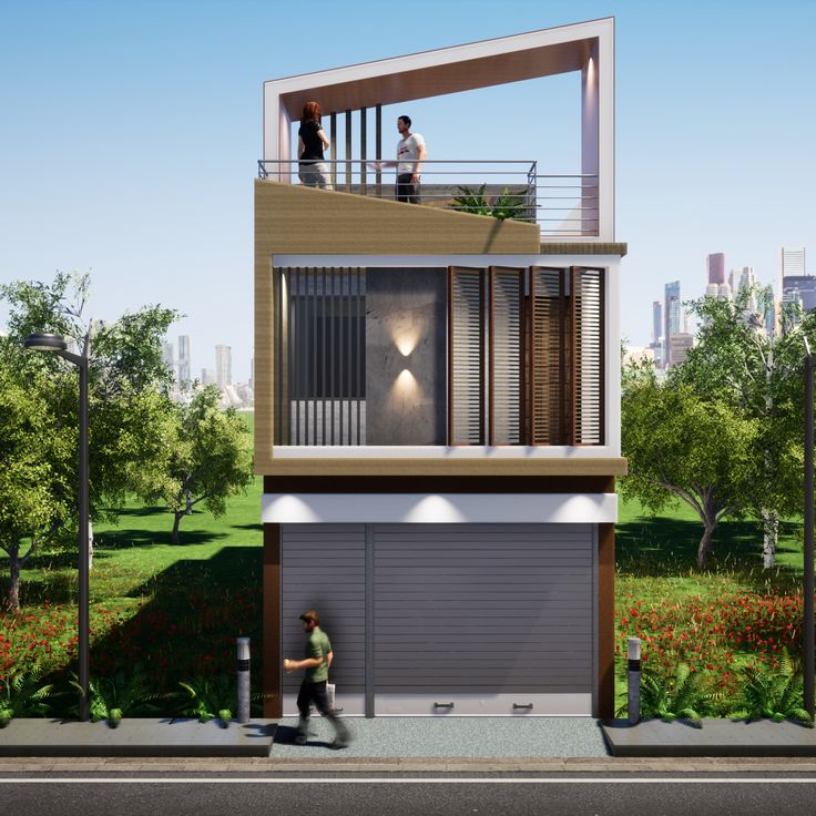 two people are standing on the balcony of a house that's surrounded by trees