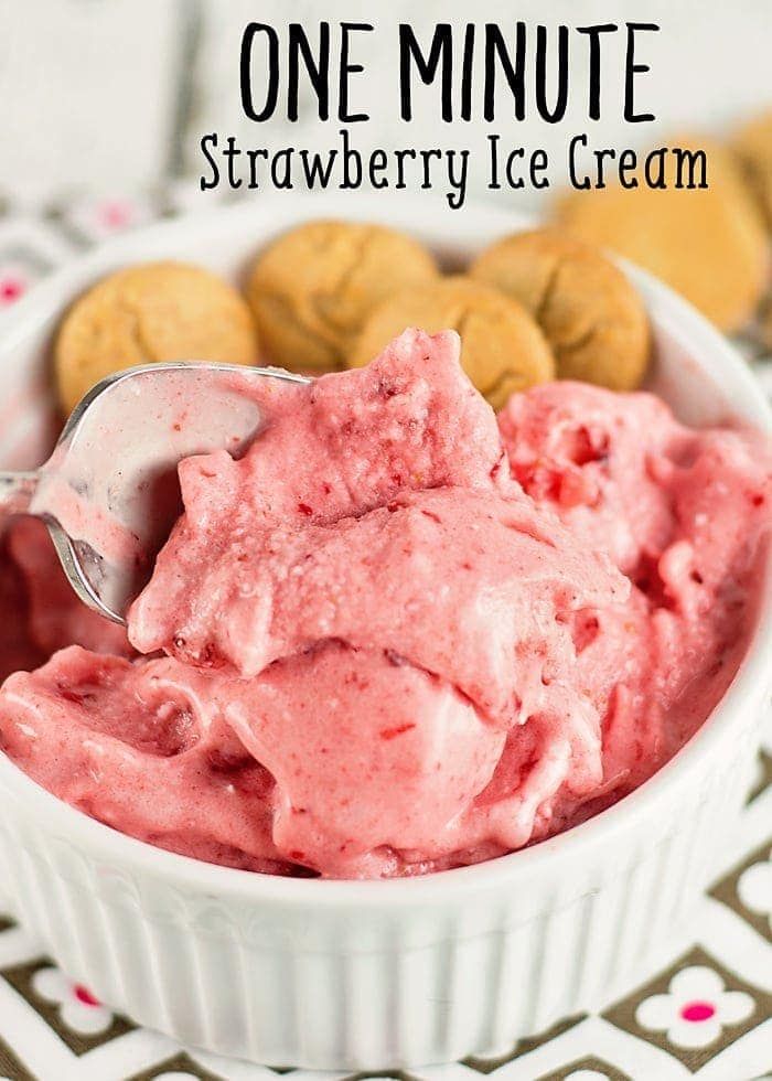 strawberry ice cream in a white bowl with cookies on the side and text overlay that reads one minute strawberry ice cream