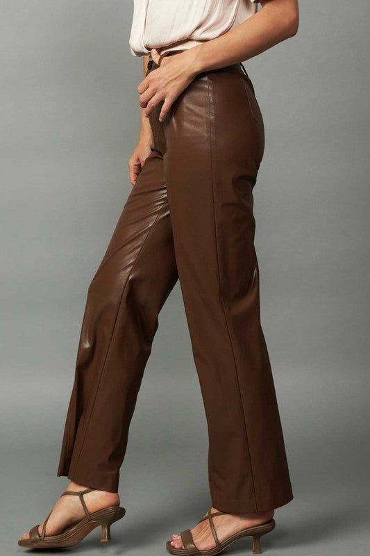 Faux leather straight leg pants. Available in chocolate brown. 55% Polyester, 45% Polyurethane Sleek Brown Leather Bottoms, Brown Straight Pants For Workwear, Brown Leather Pants For Night Out, Sleek Brown Faux Leather Pants, Sleek Brown Faux Leather Bottoms, Trendy Brown Faux Leather Pants, Elegant Brown Full-length Leather Pants, Elegant Brown Leather Pants Full Length, Elegant Full-length Brown Leather Pants