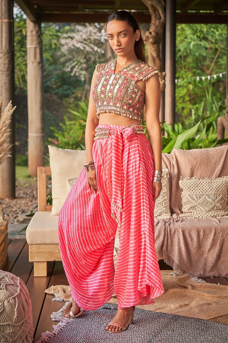 Neon pink crepe crop top with shells, sequins and beaded hand embroidery.
Components: 1
Pattern: Hand embroidered
Type Of Work: Shells, Sequins, Beads
Neckline: V Neck
Sleeve Type: Sleeveless
Fabric: Crepe
Color: Pink
Other Details: 
Note : Pant and hand cuffs worn by the model is not for sale.
Occasion: Mehendi and Haldi,Sangeet - Aza Fashions Beads Fabric, Beaded Crop Top, Hand Cuffs, Crop Top For Women, Crop Tops Online, Pant For Women, Embroidered Crop Tops, Beaded Neckline, Fabric Beads