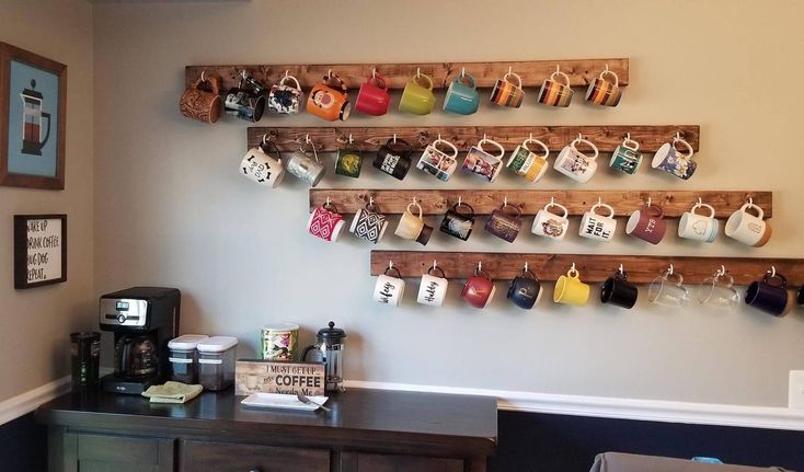 a coffee bar with cups hanging on the wall