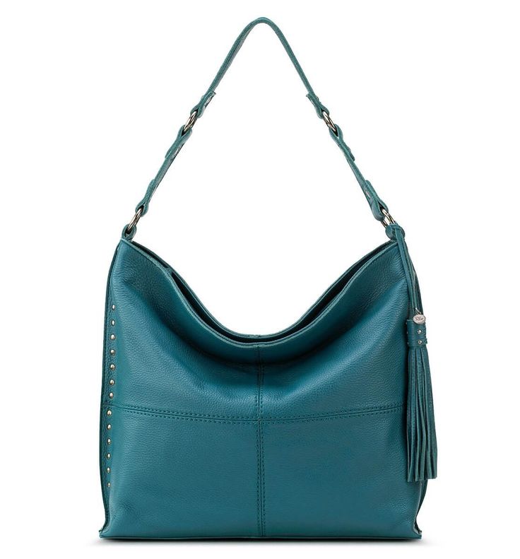 Silverlake City Hobo Teal The soft pebble leather of this timeless silhouette makes this bag your new everyday bag! With a zipper closure, spacious interior, and stylish slouch, this bag is perfect to carry all of your essentials and more!Exterior: LeatherInterior: Repreve LiningAntique silver-tone hardwareMain zipper closureBack zipper pocketInterior contains 2 front slip pockets, 1 back wall zipper pocket, and 1 slip pocketStudded detail and single shoulder strapFeatures hand-crafted leather t Vegan Purses, Polished Pebble, Chic Leather, Over 50 Womens Fashion, Silver Lake, Leather Hobo Bag, The Sak, Hobo Handbags, Leather Tassel