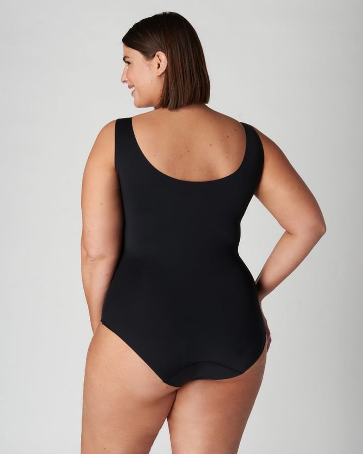 A sleeveless plus size top to transform your workwear and everyday outfits Supportive Seamless Shapewear Bodysuit, Black Seamless Full Coverage Bodysuit, Compressive Full Coverage Seamless Bodysuit, Black Seamless Shapewear Bodysuit, Supportive Full Coverage Smoothing Bodysuit, Supportive Full Coverage Solid Bodysuit, Black Micro-elastic Shapewear Bodysuit, Black Second-skin Bodysuit With Built-in Bra, Black Full Coverage Second-skin Shapewear