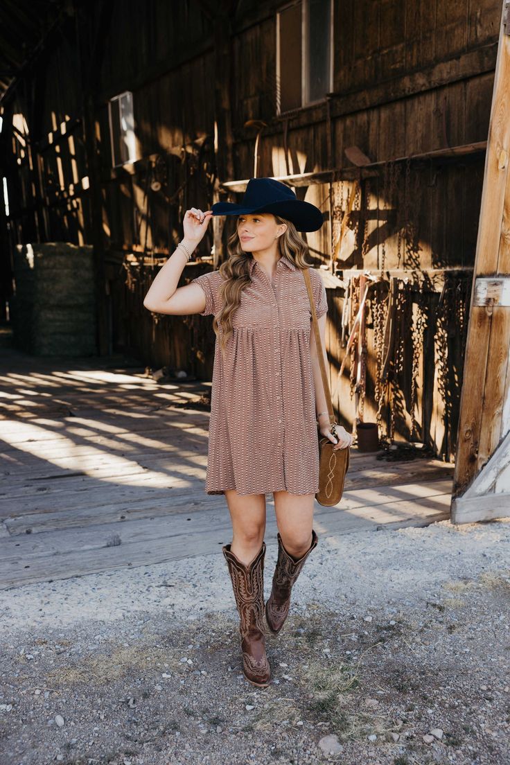 Introducing The Zuri Dress, a playful knee-length western dress in a gorgeous rust color. Made from textured fabric, this dress features a flattering fit and flare silhouette with short sleeves and a v neckline. Complete with a collared button down design and pocket detail, it's the perfect dress for fall fun! Haylee is wearing size small paired with the Ariat Casanova Boots, Felt Cowboy ProHat and The Talia Bag Zuri Dress, Dress For Fall, Western Dress, Curvy Dress, Heritage Collection, Western Dresses, Rust Color, Fall Fun, Textured Fabric