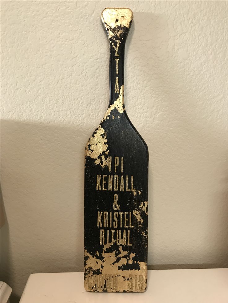 an old wooden bottle sign that says pi kendall and kristell ritual on it