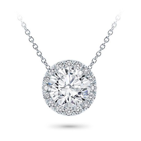 This halo pendant setting is stunning and can accommodate a round center diamond of your choice from 0.20-5.0ct. Pendant features approx. 18 G-H VS diamonds at approx. 0.20cttw. Metal options are 14k and 18k white and yellow gold, 18k rose, or platinum and includes a 16 chain. Classic Round Pendant Jewelry, Unique Diamond Pendant, Cushion Cut Solitaire, Round Diamond Pendant, Diamond Pendants Designs, Halo Necklace, Diamond Necklace Set, Diamond Solitaire Necklace, Sparkly Things